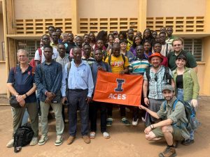 a group of people with an ACES flag